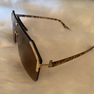Beautiful pair of gently used Gucci Sunglasses, Gold Trim around outer lens